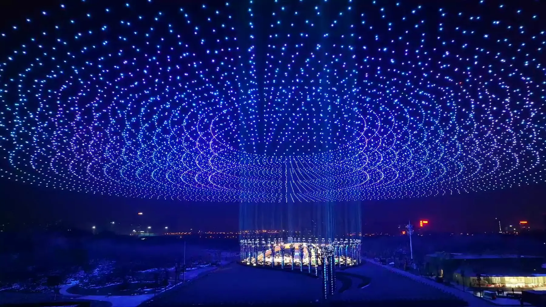 Dome of light formed by drones, representing the precision of the coordinated flight system