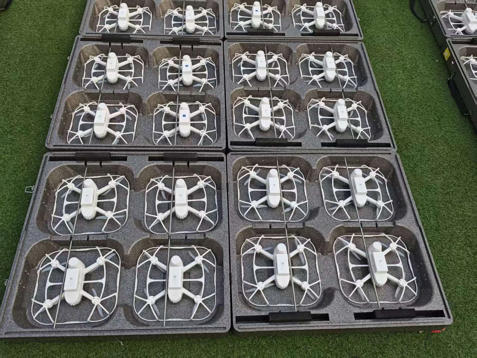 Fleet of folded drones ready on the ground before a show